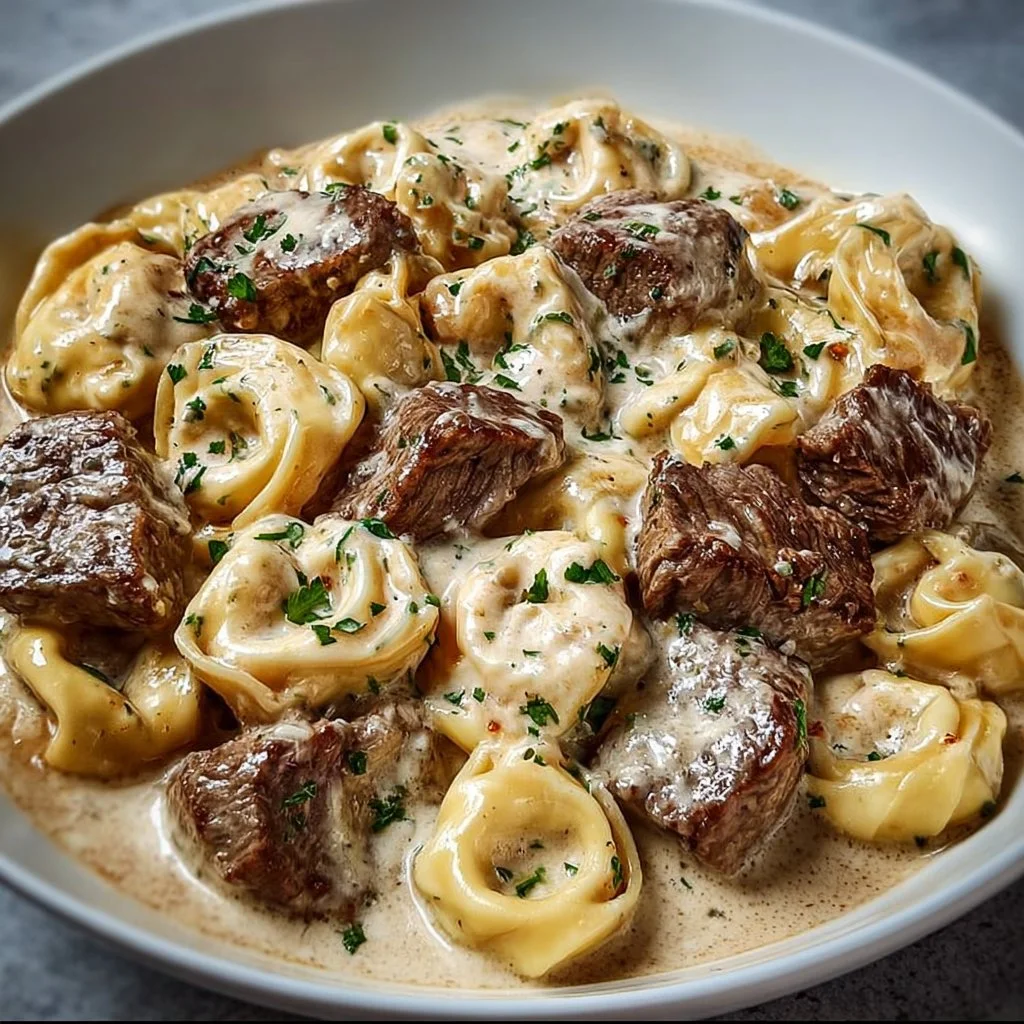 Cracked Garlic Steak Tortellini served in creamy sauce with herbs and spices