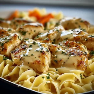 One-Pan Chicken with Buttered Noodles 4 One-Pan Chicken served with buttered noodles on a plate